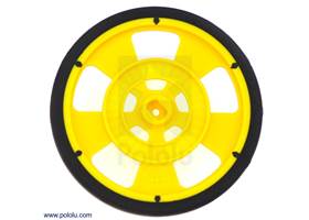 Yellow Solarbotics GMPW wheel with silicone tire.  This view shows the hub designed for the Solarbotics GM gearbox output shafts and the 64-stripe encoder pattern