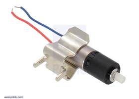 26:1 sub-micro plastic planetary gearmotor being held by a 1/4″ (6 mm) fuse clip