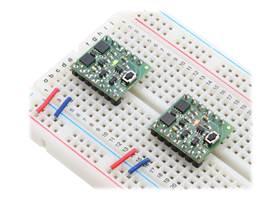 Mini Pushbutton Power Switches in a breadboard (SV version on left and LV version on right)