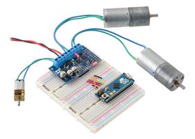 An Arduino Micro on a breadboard using a Motoron M3H256 to control three motors.