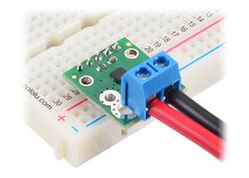 ACS71240 Current Sensor Carrier with a 5mm-pitch terminal block for the current path and header pins soldered for use with a breadboard.